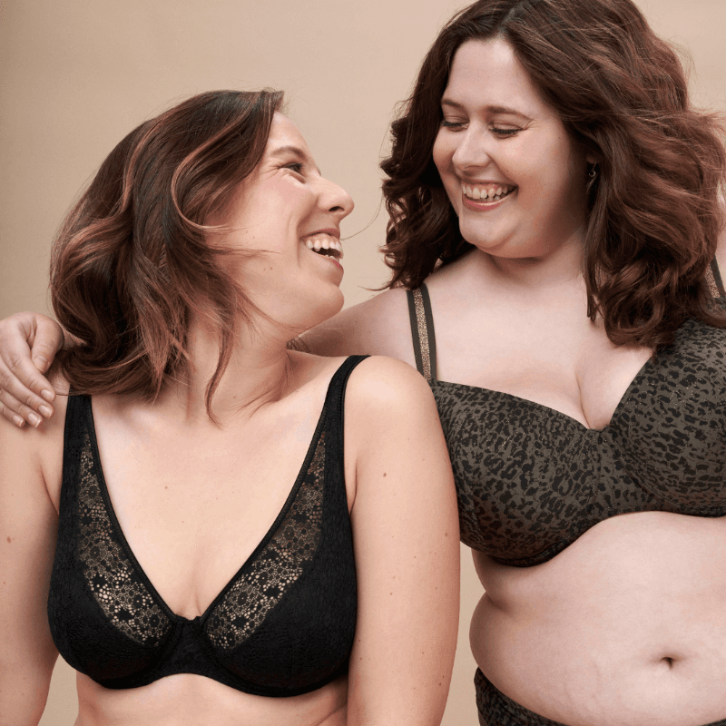 Two customers laughing together — a candid moment of connection