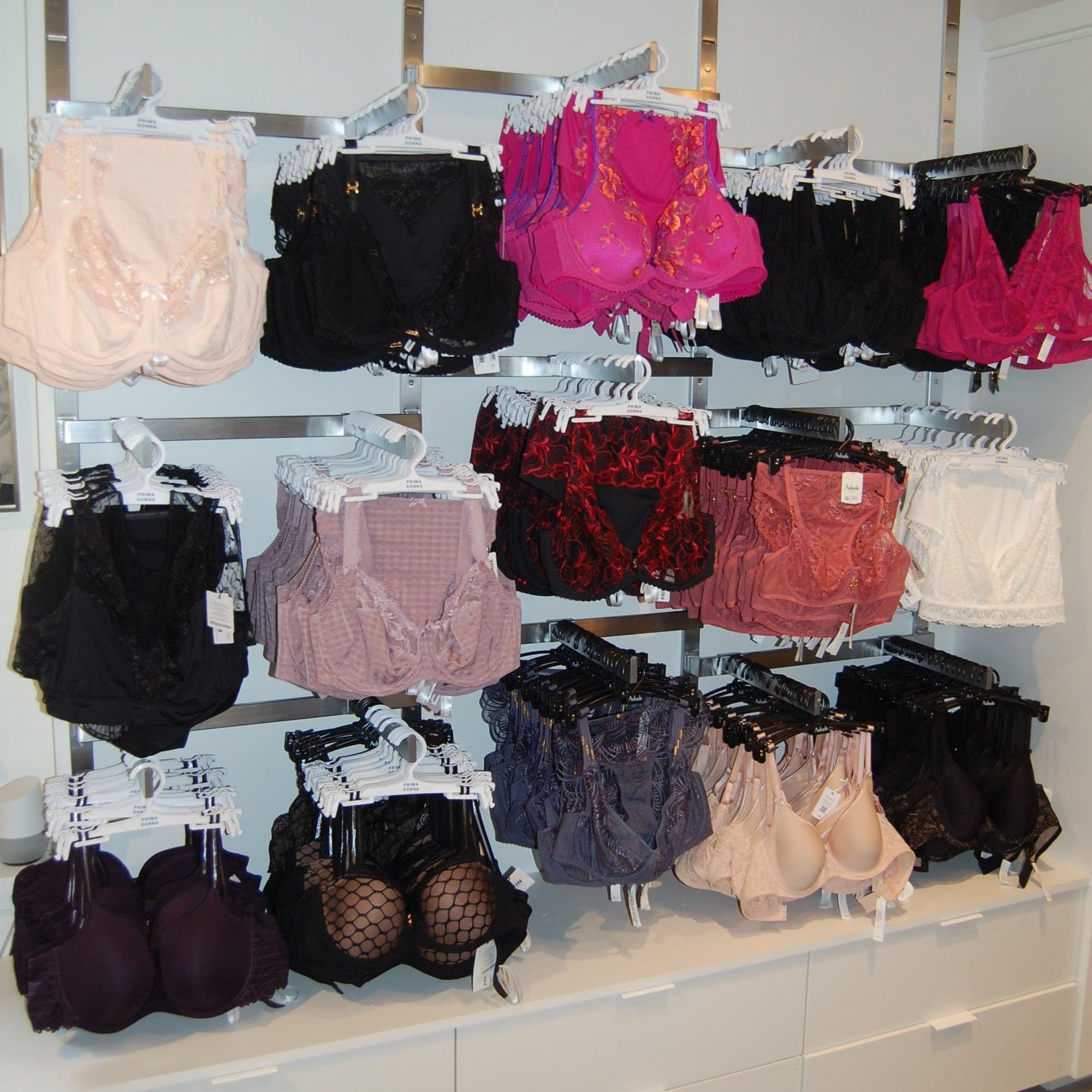 Densely styled bra display in lace, mesh and patterns